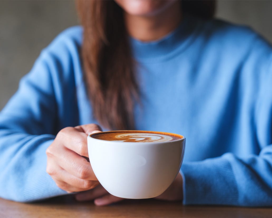 Woman holding a cup of coffee