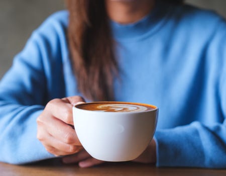 Woman holding a cup of coffee
