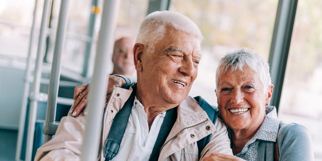 Friendly couple taking the bus