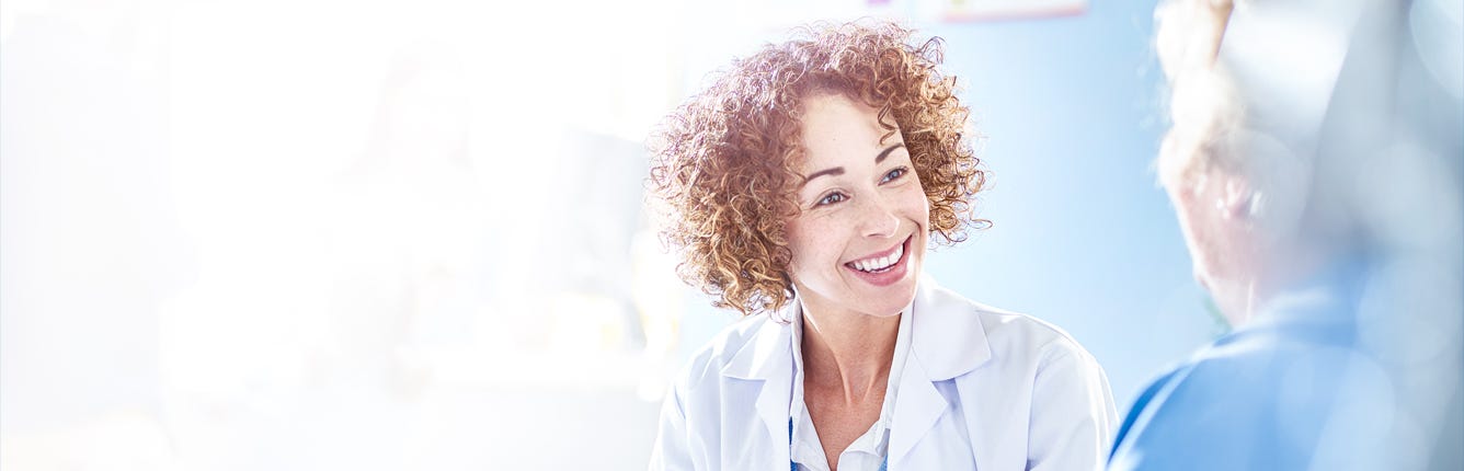 Nurse Talking To Patient