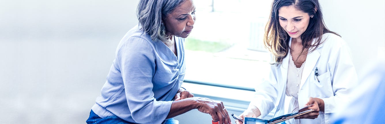 Nurse Explaining to Patient