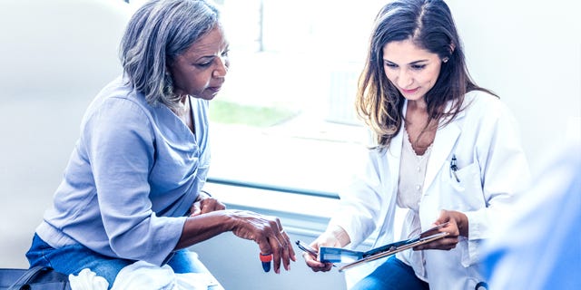 Nurse Explaining to Patient