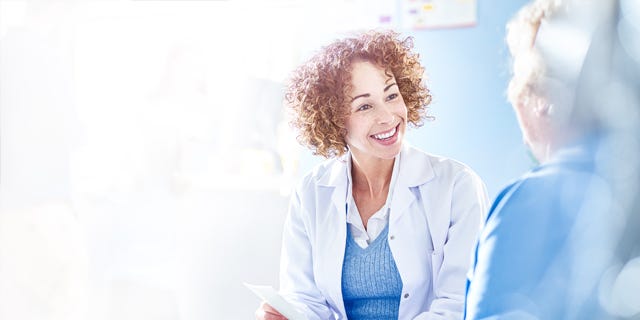 Nurse Talking To Patient