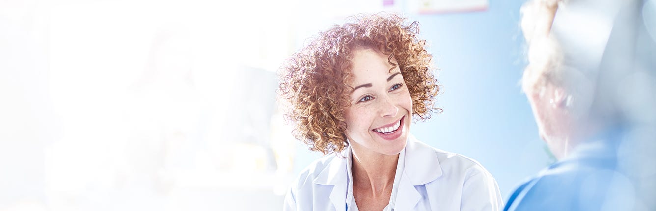 Healthcare Professional Talking To Patient