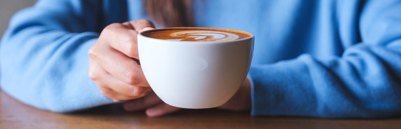 Women holding a cup of coffee